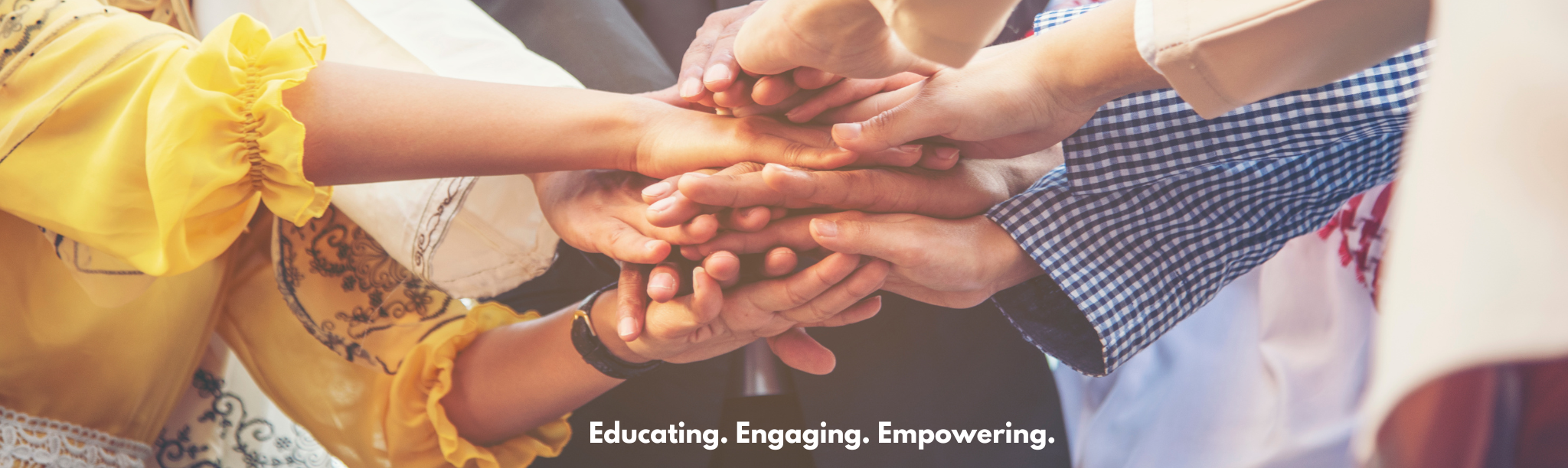 Diverse hands together. Engaging. Educating. Empowering.